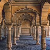 Ornate-carved-stone-pillars-in-Amber-Fort